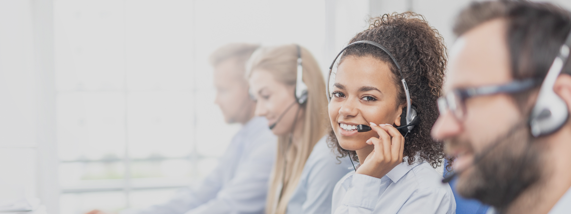call center agents with woman smiling